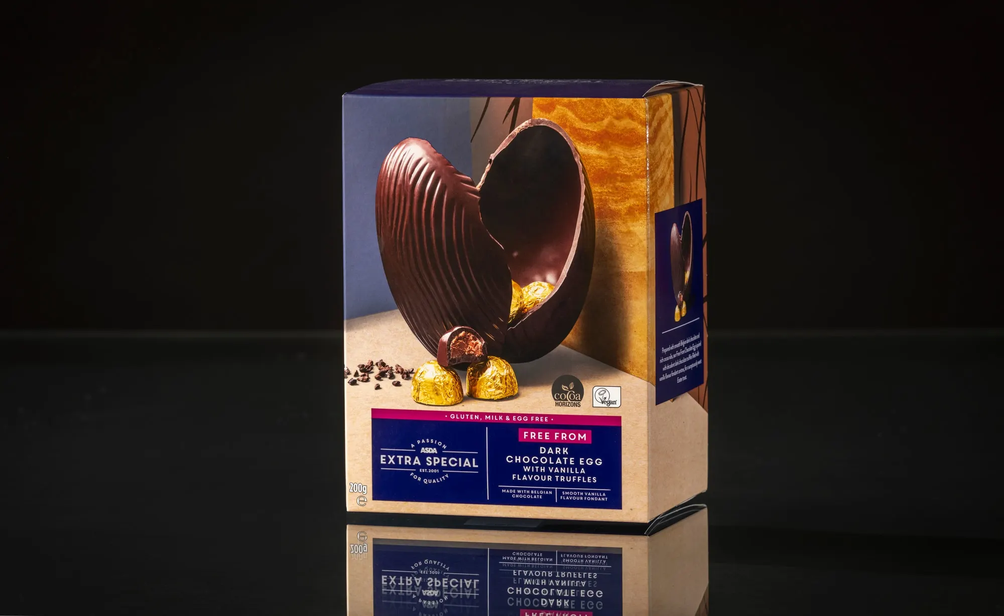Asda Extra Special dark chocolate egg carton with a die-cut window, photographed on a black reflective ground