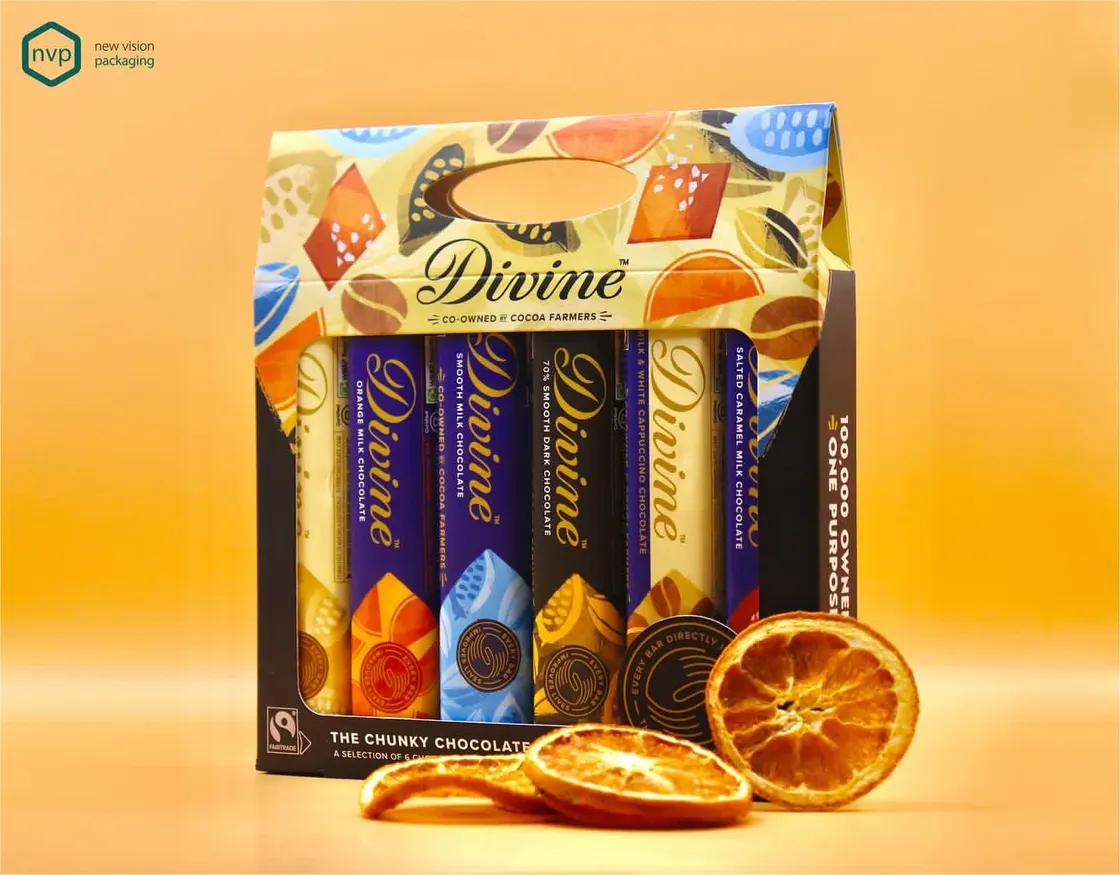 Divine chocolate bars presented upright in a printed open-fronted gift carton