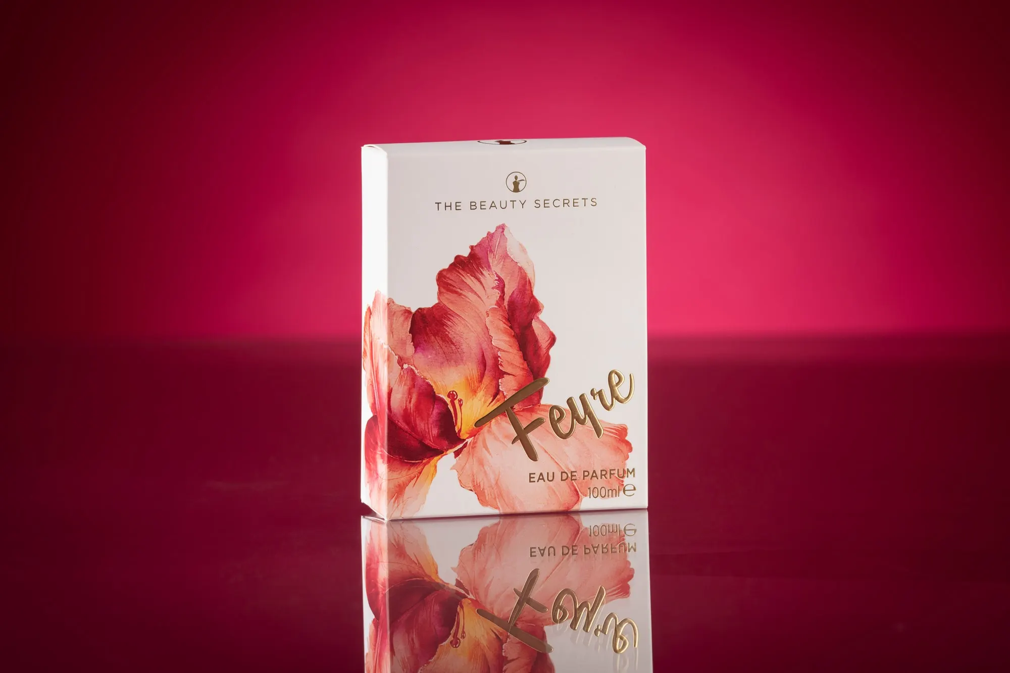 White Feyre Eau de Parfum carton printed with a watercolour flower, photographed on a deep pink ground
