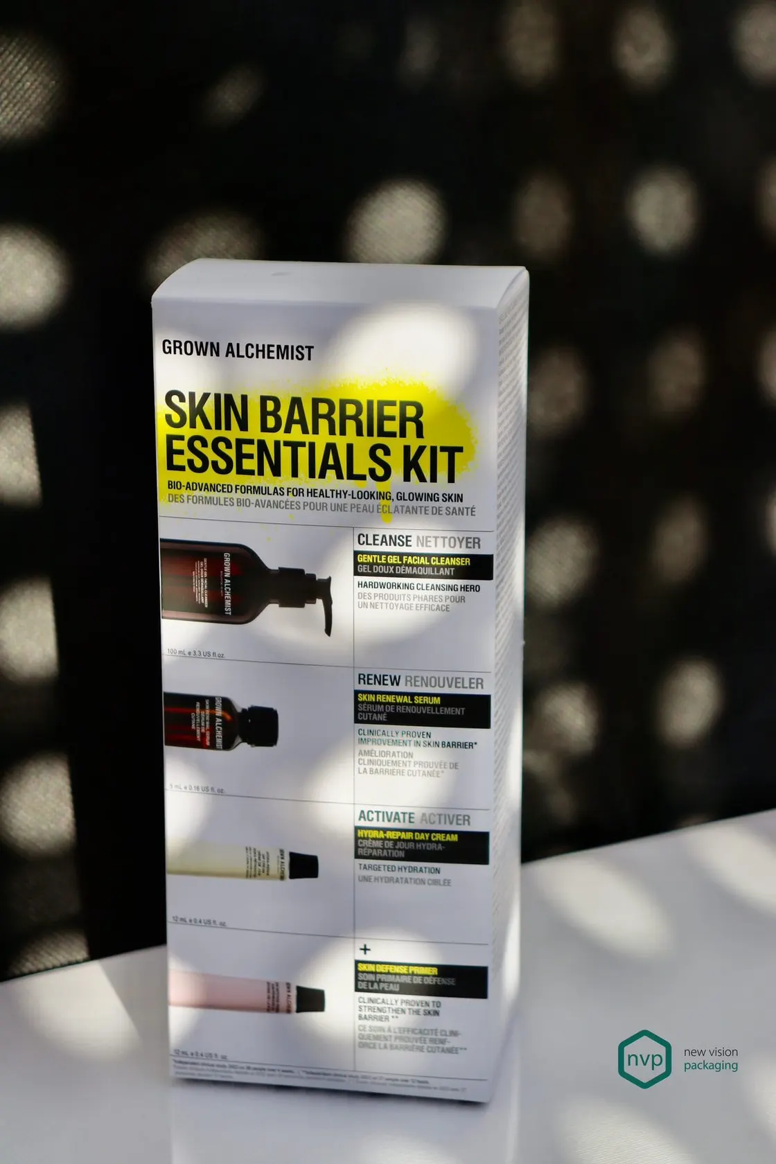 Grown Alchemist Skin Barrier Essentials Kit carton with die-cut windows showing each of the four products