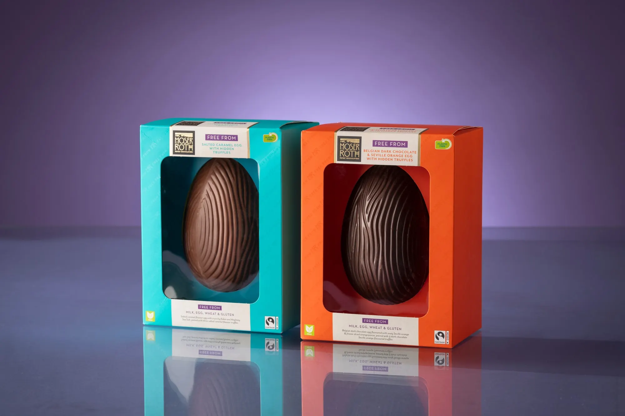 Two Moser Roth Easter egg cartons in teal and orange with die-cut windows showing the eggs
