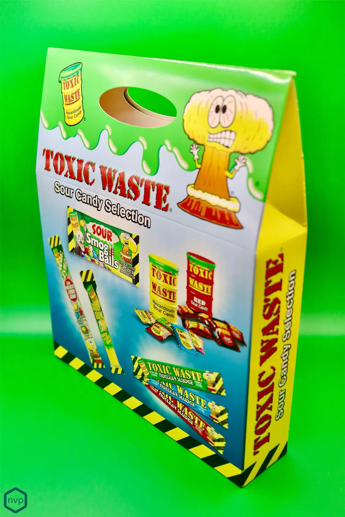 Toxic Waste Sour Candy Selection carrier carton with a die-cut handle, printed in green slime and hazard stripes