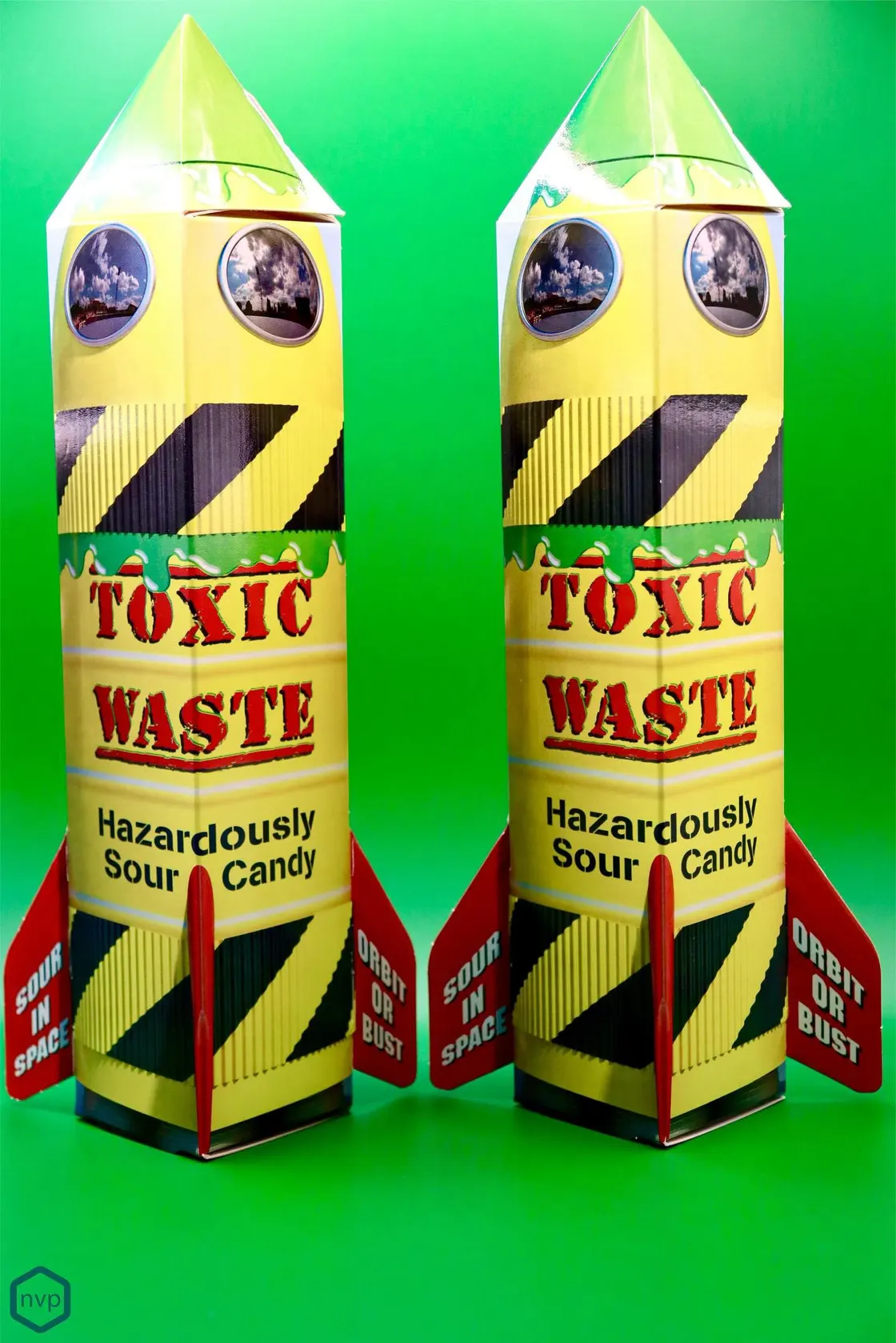 Two Toxic Waste rocket-shaped cartons in yellow and black, die-cut and printed as fireworks