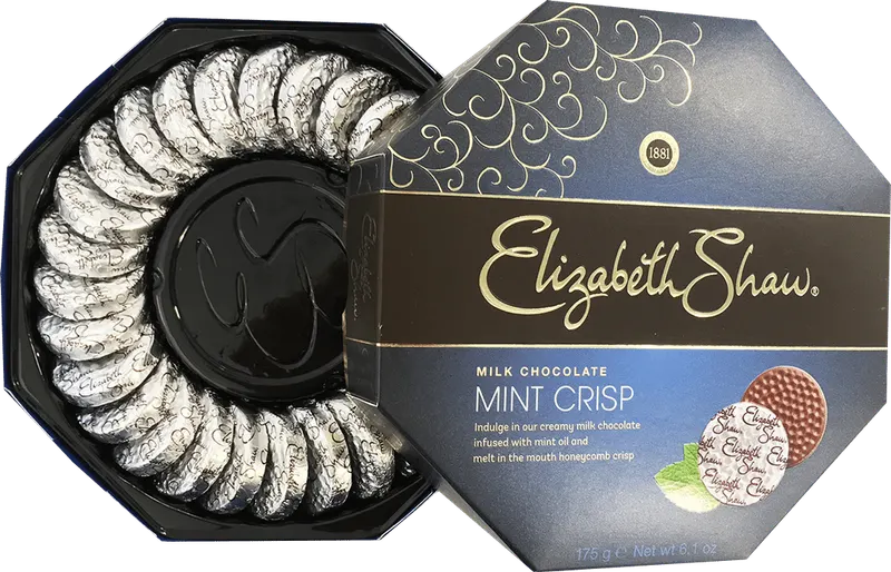 Elizabeth Shaw mint crisp carton beside the black vacuum formed rosette tray that holds the chocolates