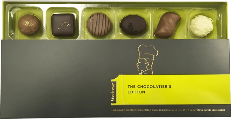 Waitrose Chocolatier Edition carton opened to show a green vacuum formed tray of six chocolates